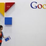 File photo of a woman walking past a logo of Google at the Global Mobile Internet Conference (GMIC) 2015 in Beijing